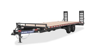 A twenty foot deck over flatbed trailer with loading ramps and tandem axles.