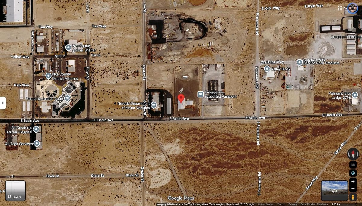 Satellite map of 1850 East Basin Avenue in Pahrump. A red pin marks the MediWaste site on the north side of East Basin Avenue. The Nevada Department of Motor Vehicles is immediately west, at Oyster Street. One block further west are the Pahrump Justice Court, the Nye County District Attorney and the Nye County Animal Shelter. Open desert lies south of East Basin Avenue.